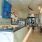 large bar with pastries and seating options near by