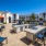 grill area with umbrella shaded tables and chairs