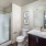 walk-in shower in bright bathroom