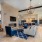 chandelier over fireplace area with seating