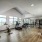 large windows brighten spacious fitness center
