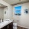 brightly lit powder room in apartment